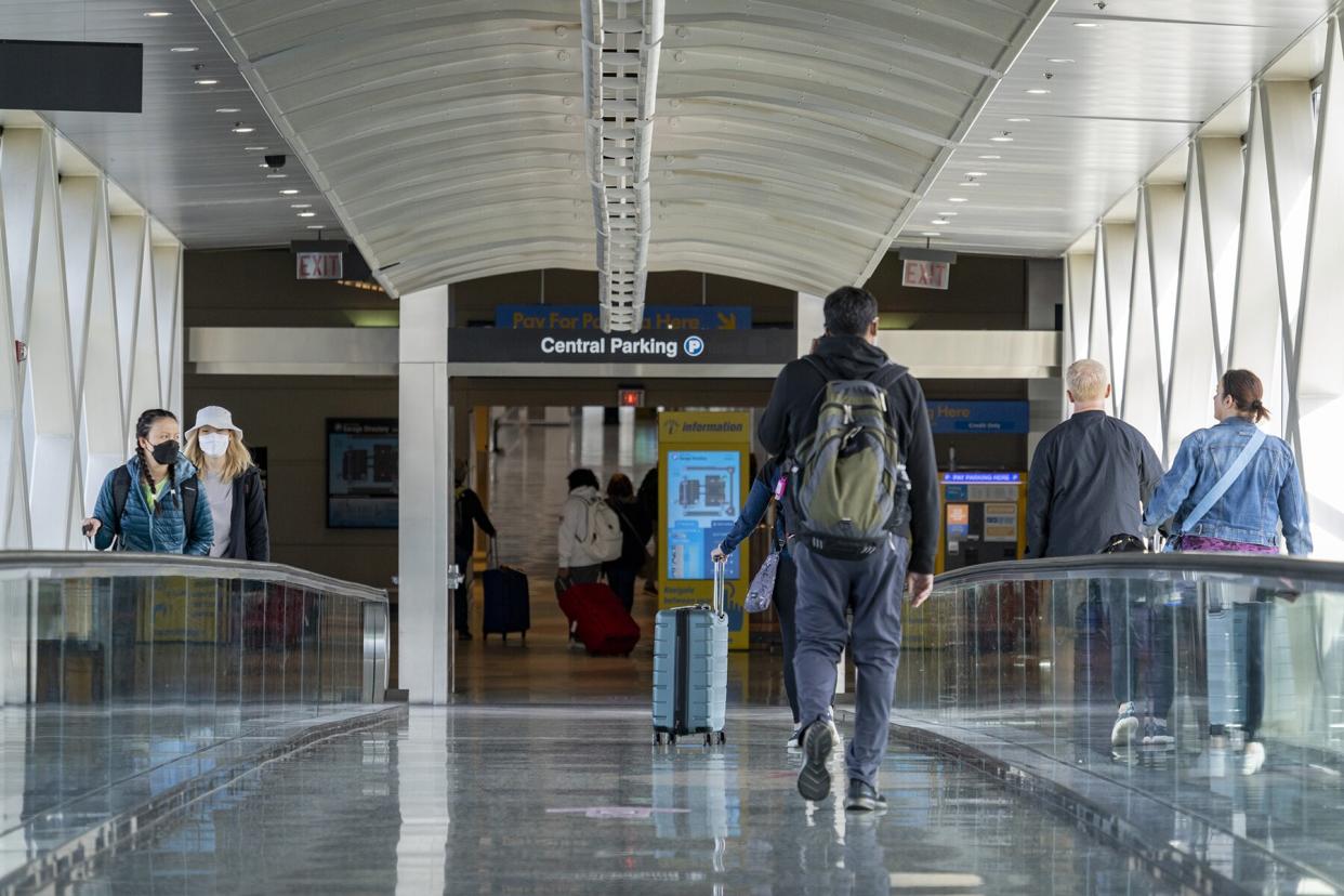 Travelers at Logan International Airport (BOS) in Boston, Massachusetts, U.S.,