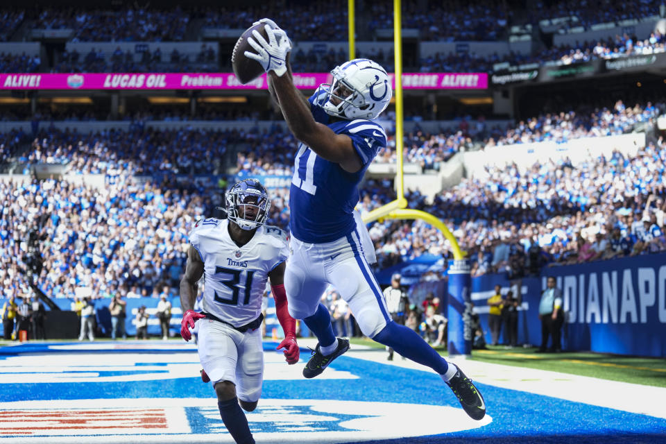 Indianapolis Colts wide receiver Michael Pittman Jr. attempts a catch in front of Tennessee Titans safety Kevin Byard in the first half of an NFL football game in Indianapolis, Fla., Sunday, Oct. 2, 2022. The pass was ruled incomplete. (AP Photo/AJ Mast)