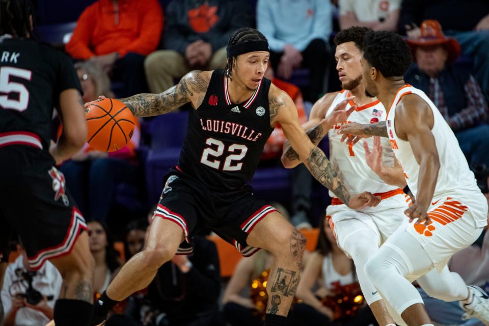 Louisville guard Tre White (22) said he thinks the team is improving each day.