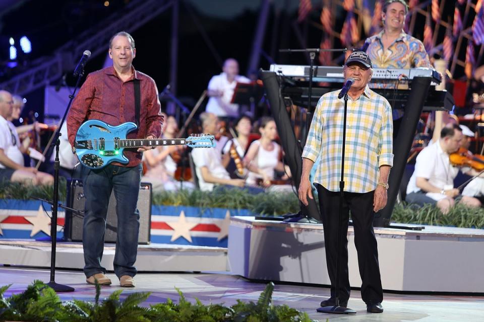 Jeffrey Foskett (L) and Bruce Johnston of The Beach Boys perform during the 27th National Memorial Day