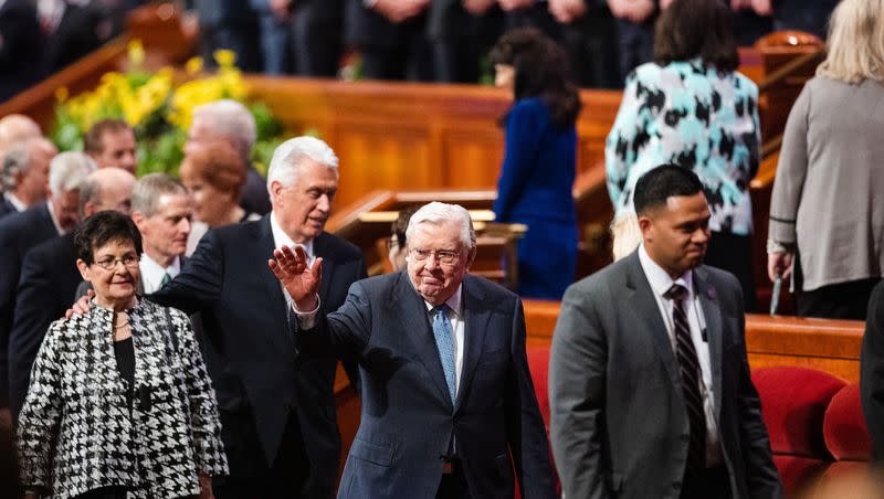 President M. Russell Ballard, acting president of the Quorum of the Twelve Apostles, waves at attendees at the Conference Center in April 2023. President Ballard was recently released from the hospital.