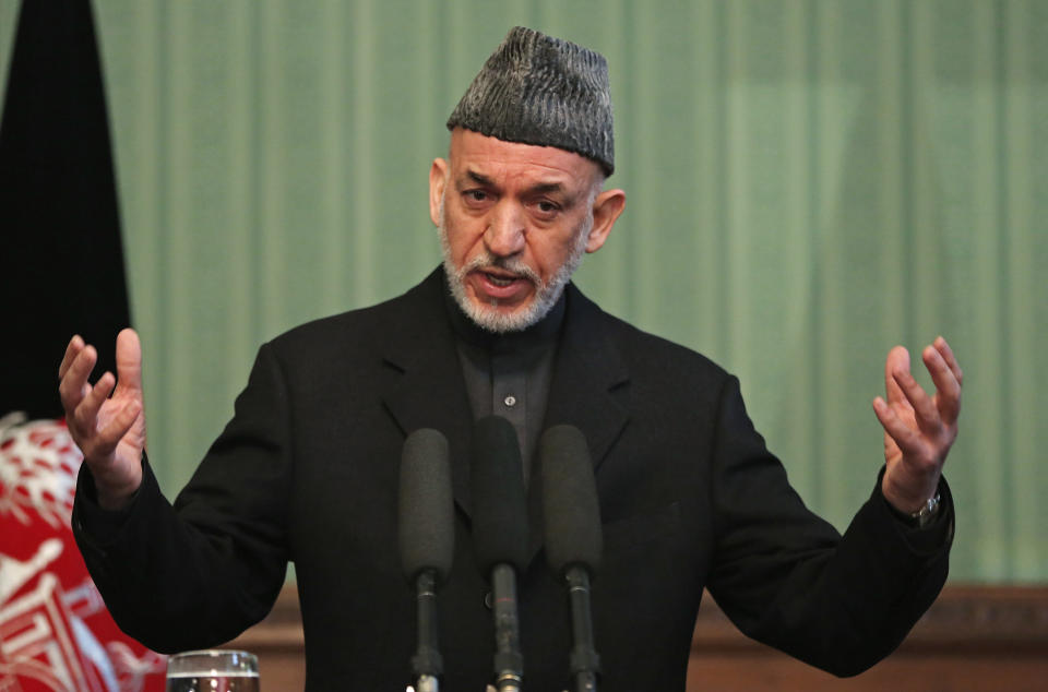 Afghan President Hamid Karzai speaks during a press conference at the presidential palace in Kabul, Afghanistan, Saturday, Jan. 25, 2014. Karzai said he will not sign a security pact with the United States unless Washington and Pakistan launch a peace process with Taliban insurgents. (AP Photo/Massoud Hossaini)