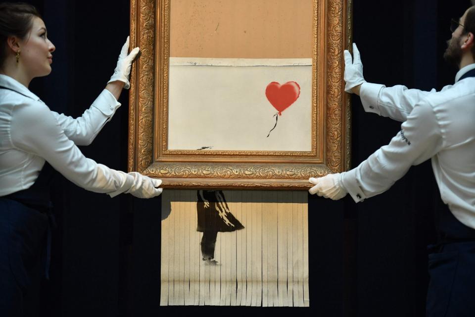 Banksy's 2018 shredded Girl With a Balloon print, retitled as Love in the Bin (AFP/Getty Images)