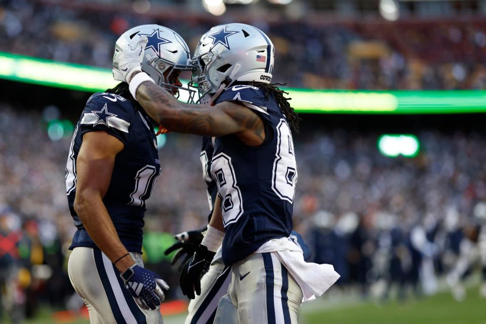 Jan 7, 2024; Landover, Maryland, USA; Dallas Cowboys wide receiver Jalen Tolbert (18) celebrates with Cowboys wide receiver CeeDee Lamb (88) after catching a touchdown pass against the Washington Commanders during the first quarter at FedExField. Mandatory Credit: Geoff Burke-USA TODAY Sports