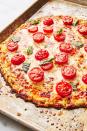 <p>Possibly our favorite use of cauliflower as a culinary master of disguise is in pizza crust. It might sound crazy but it can be a delicious and healthy alternative to the classic. In this easy, gluten-free pizza recipe, you're basically making <a href="https://www.delish.com/cooking/recipe-ideas/a25564976/how-to-make-cauliflower-rice/" rel="nofollow noopener" target="_blank" data-ylk="slk:cauliflower rice;elm:context_link;itc:0;sec:content-canvas" class="link ">cauliflower rice</a> as base the base for your crust.</p><p>Get the <strong><a href="https://www.delish.com/cooking/recipe-ideas/recipes/a47565/cauliflower-crust-pizza-recipe/" rel="nofollow noopener" target="_blank" data-ylk="slk:Cauliflower Pizza Crust recipe;elm:context_link;itc:0;sec:content-canvas" class="link ">Cauliflower Pizza Crust recipe</a>.</strong></p>