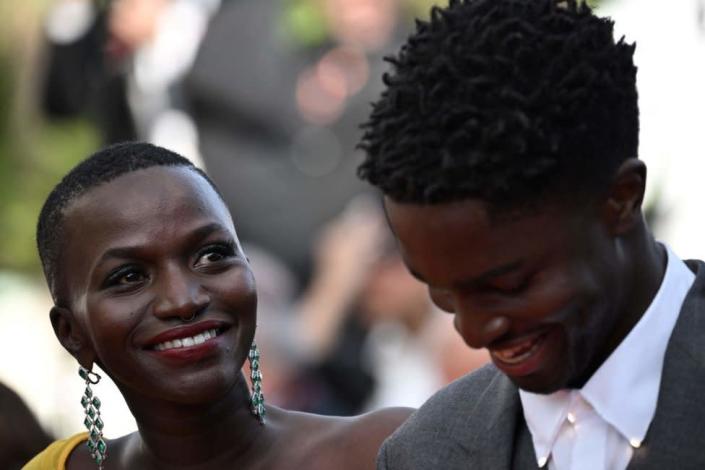 French actress Annabelle Lengronne (L) and French-Congolese comedian Stephane Bak arrive for the screening of the film &quot;Mother And Son (Un Petit Frere)&quot; during the 75th edition of the Cannes Film Festival in Cannes, southern France, on May 27, 2022.