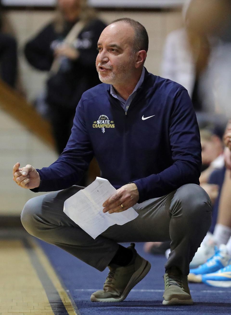 Hoban boys basketball coach TK Griffith calls plays from the sideline, Friday, Jan. 5, 2024.