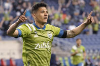 Seattle Sounders forward Fredy Montero celebrates after scoring a goal against Minnesota United during the second half of an MLS soccer match Friday, April 16, 2021, in Seattle. The Sounders won 4-0. (AP Photo/Ted S. Warren)