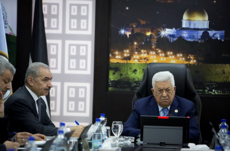 Palestinian President Mahmoud Abbas chairs a session of the weekly cabinet meeting with Palestinian Prime Minister Mohammad Shtayyeh, in Ramallah in the Israeli-occupied West Bank