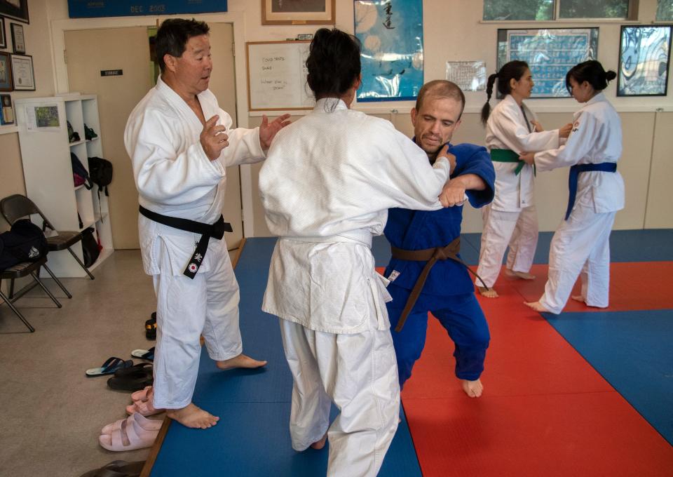 Sensei Steve Ikeda, left, gives instruction to Susan Hok and Rob Crumly during a practice of the Stockton Judo Club at the McKinley Park Community Center in south Stockton.