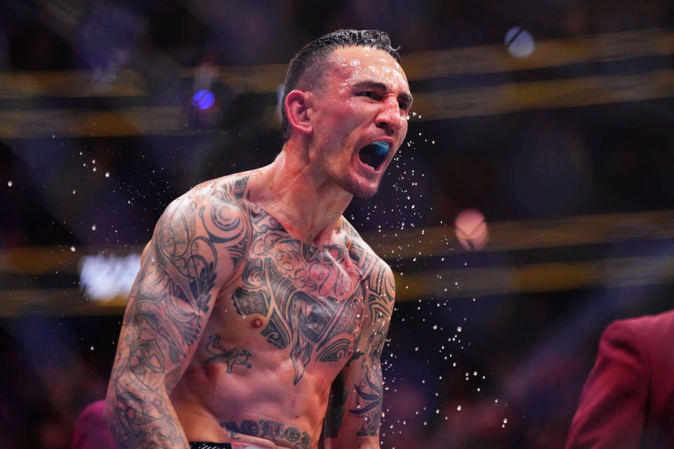 LAS VEGAS, NV – APRIL 13: Max Holloway KOs Justin Gaethje in a BMF Championship bout during the UFC 300 event at T-Mobile Arena on April 13, 2024 in Las Vegas, NV. react to things.  (Photo by Cooper Neill/Zuffa LLC, Getty Images)