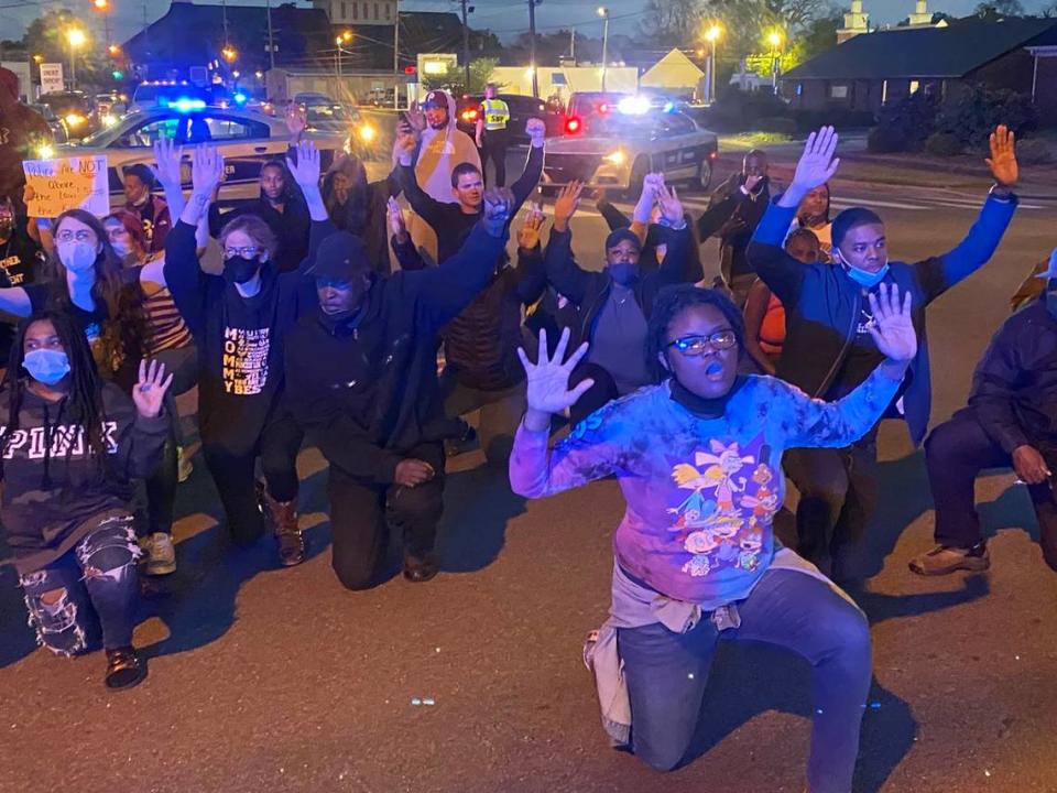 Demonstrators in Elizabeth City, N.C. block traffic while shouting “This is what we look like on the ground” as they protest the shooting death of Andrew Brown Jr. by Pasquotank deputies Wednesday, April 21, 2021.