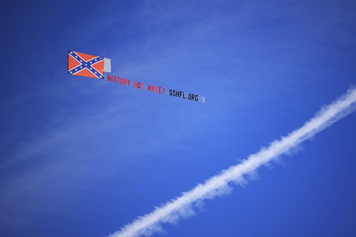 An airplane flies a Confederate-supporting message before a regular season NFL football matchup between the Jacksonville Jaguars and the Dallas Cowboys on Sunday at TIAA Bank Field.