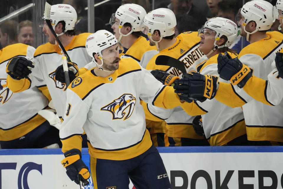 Nashville Predators left wing Filip Forsberg (9) celebrates with teammates on the bench after scoring on Toronto Maple Leafs goaltender Matt Murray during the second period of an NHL hockey game, Wednesday, Jan. 11, 2023 in Toronto. (Frank Gunn/The Canadian Press via AP)