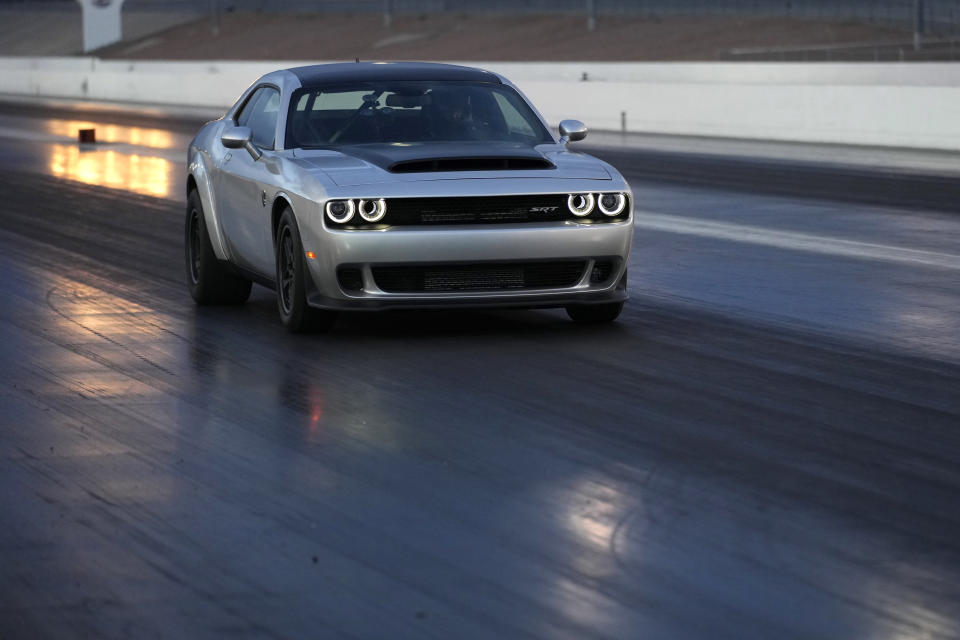The 2023 Challenger SRT Demon 170 drives along a drag strip during an event to unveil the car Monday, March 20, 2023, in Las Vegas. (AP Photo/John Locher)
