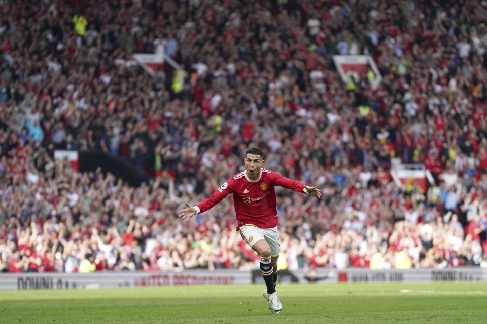 Manchester United's Cristiano Ronaldo celebrates after scoring his third goal during the English Premier League soccer match between Manchester United and Norwich City at Old Trafford stadium in Manchester, England, Saturday, April 16, 2022. (AP Photo/Jon Super)