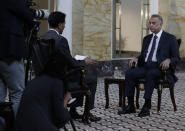 Iraqi Prime Minister Mustafa al-Kadhimi sits during an interview with The Associated Press in Baghdad, Iraq, Friday, July 23, 2021. (AP Photo/Khalid Mohammed)