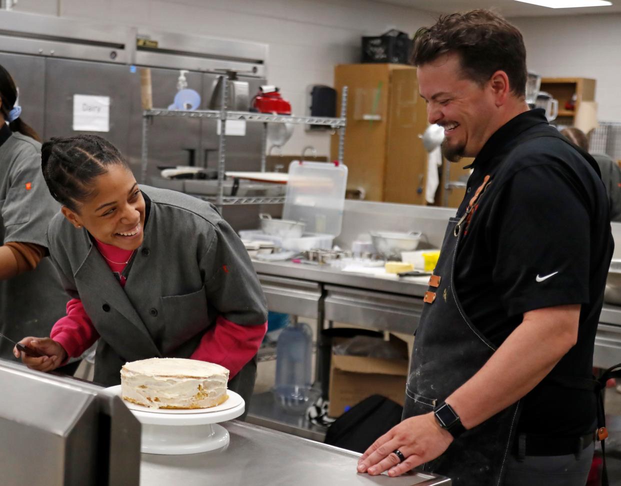 Da'Niyah Johnson laughs with SJ Houston during his class on a lesson in cake icing, Tuesday, April 16, 2024, at Lafayette Jeff High School in Lafayette, Ind.