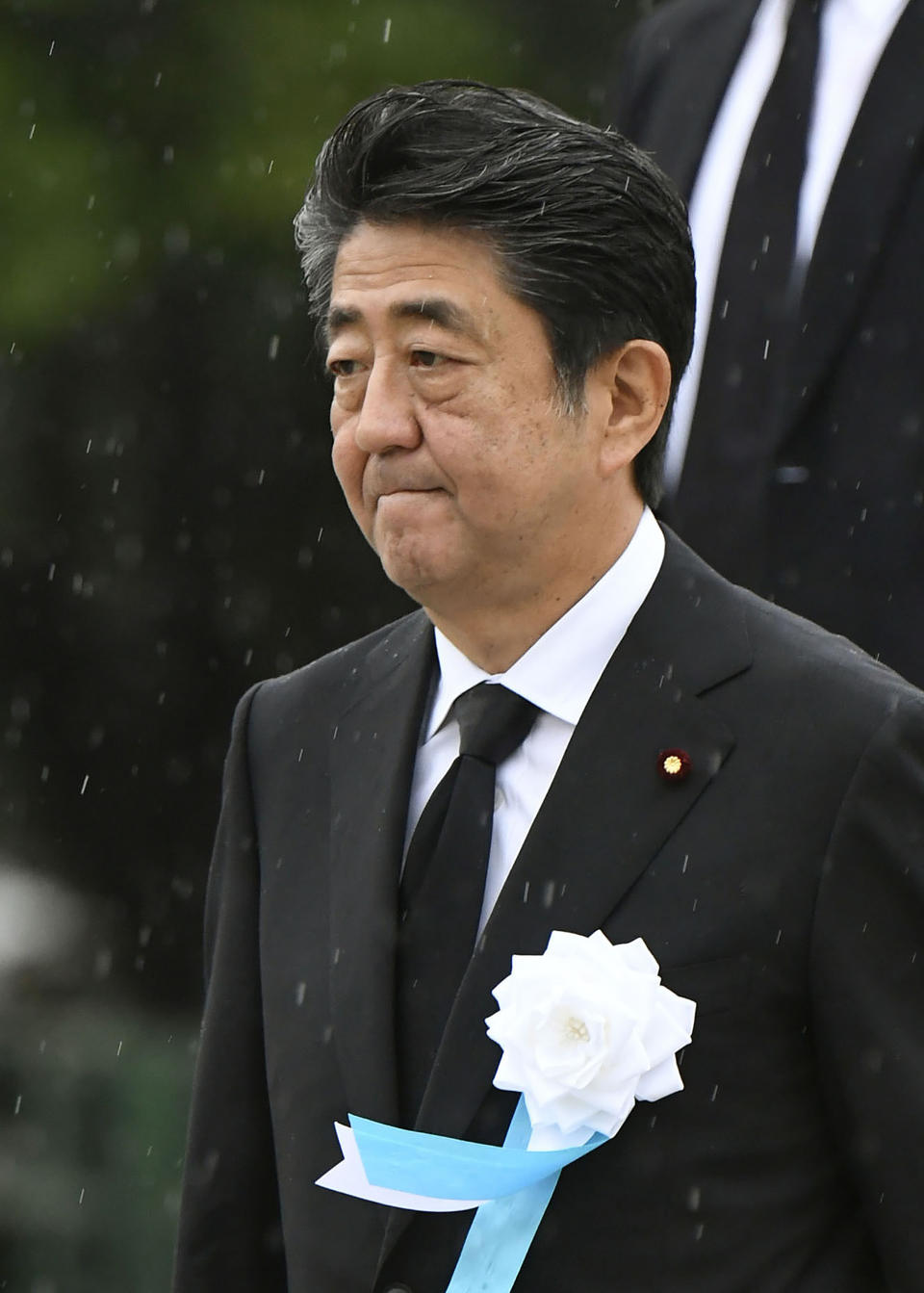 Japanese Prime Minister Shinzo Abe leaves after his speech during a ceremony to mark the 74th anniversary of the atomic bombing at the Hiroshima Peace Memorial Park in Hiroshima, western Japan Tuesday, Aug. 6, 2019. (Kyodo News via AP)