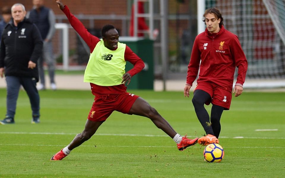 Lazar Markovic challenges with Sadio Mane during training session - Liverpool FC