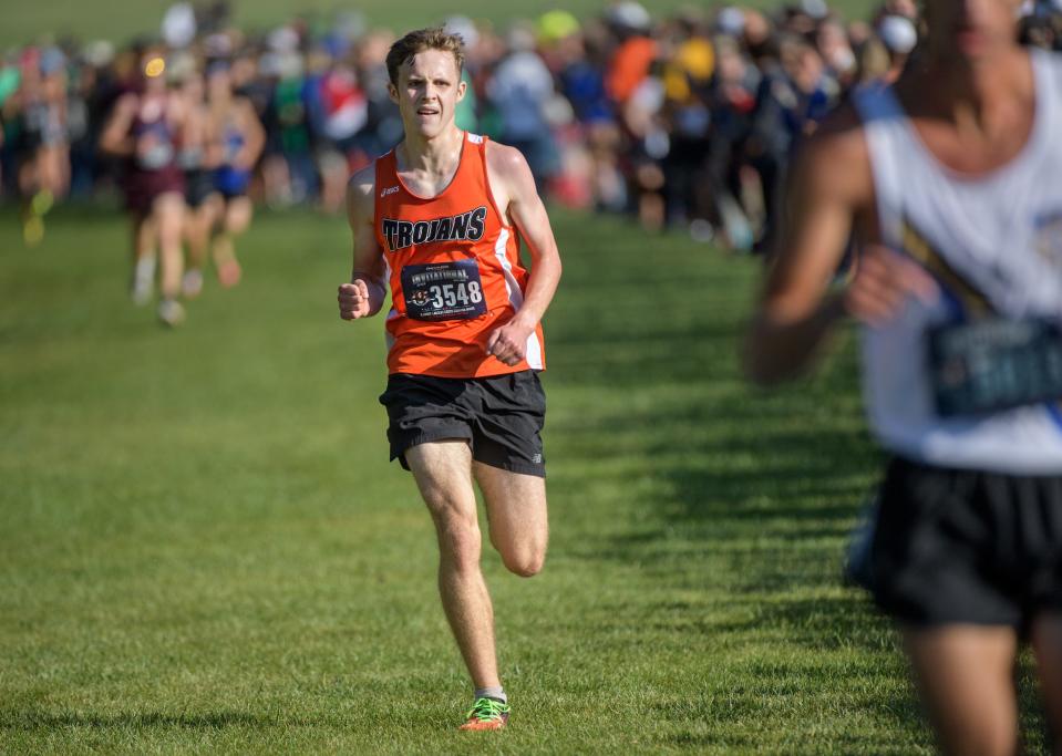 Elmwood's Isaiah Hill runs to sixth place in the Class 1A boys race of the First to the Finish Cross Country Invitational on Saturday, Sept. 9, 2023 at Detweiller Park. Hill led the Trojans to a third-place team finish.