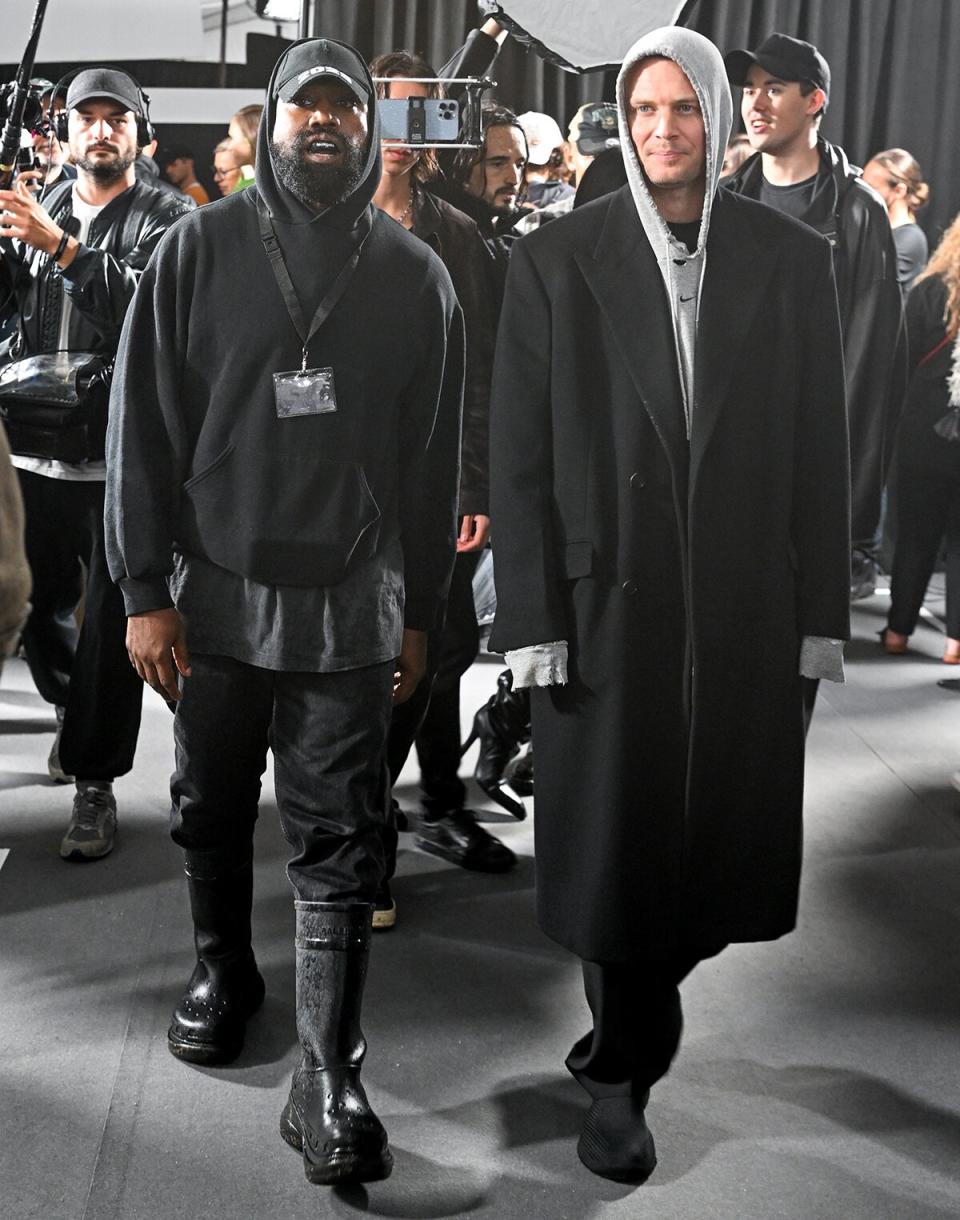 Kanye West and designer Matthew Williams attend the Givenchy Womenswear Spring/Summer 2023