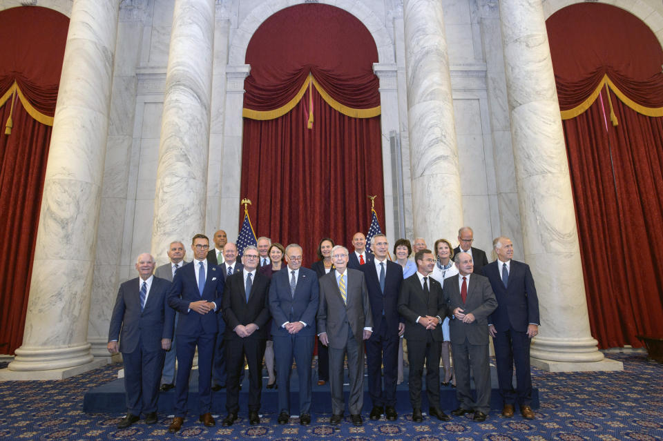 United States Senate Majority Leader Sen. Chuck Schumer, D-N.Y., center left, and United States Senate Minority Leader Sen. Mitch McConnell, R-Ky., center right, pose with from front row left are Sen. Ben Cardin, D-Md., Finnish President Alexander Stubb, United Kingdom Prime Minister Keir Starmer, NATO Secretary General Jens Stoltenberg, Swedish Prime Minister Ulf Kristersson, Sen. Jim Risch, R-Idaho, Sen. Thom Tillis, R-N.C., and a group of bipartisan Senators, as NATO leaders visit Capitol Hill, Wednesday, July 10, 2024, in Washington. (AP Photo/Rod Lamkey, Jr.)