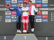 Denmark's Mads Pedersen, center, winer of the men elite race, stands on the podium with second placed Italy's Matteo Trentin, left, and third placed Switzerland's Stefan Kung, at the road cycling World Championships in Harrogate, England, Sunday, Sept. 29, 2019. (AP Photo/Manu Fernandez)