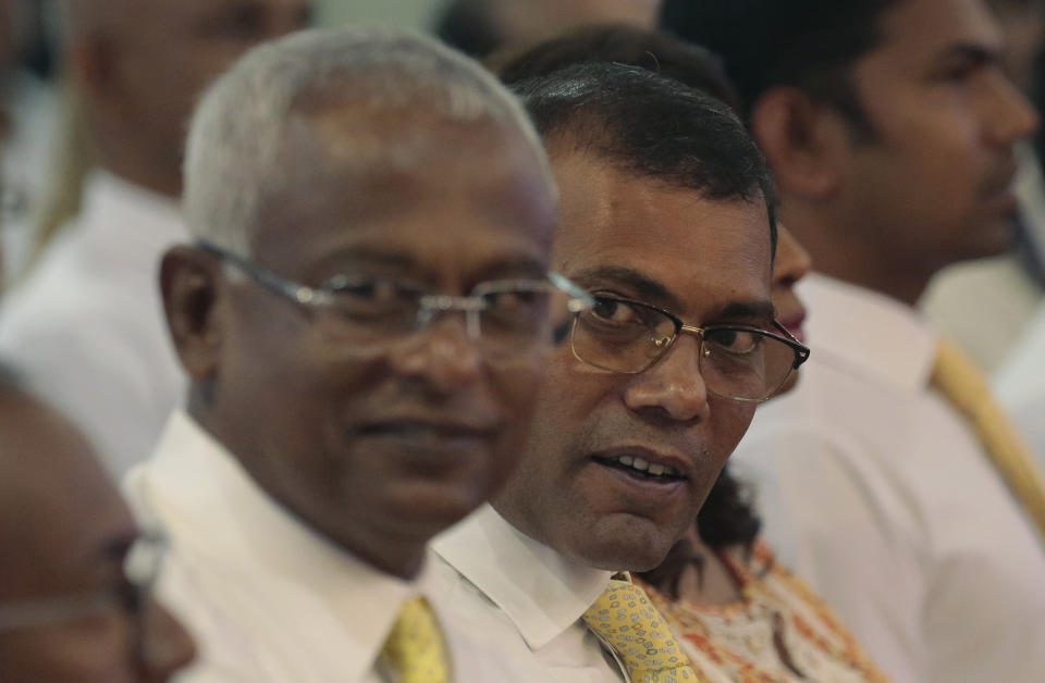 Former Maldivian President Mohamed Nasheed, right, and opposition presidential candidate Ibrahim Mohamed Solih, left, attend a meeting with the members of Maldivian community living in Sri Lanka, in Colombo, Sri Lanka, Monday, Aug. 27, 2018. Maldives' opposition presidential candidate has expressed fears that the next month's presidential election would not be free and fair, accusing that the government may rig the election. (AP Photo/Eranga Jayawardena)