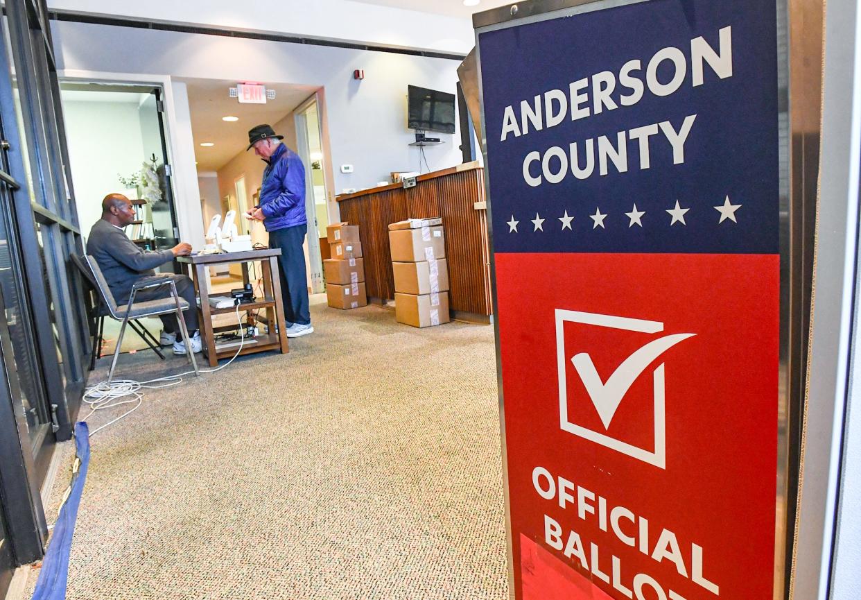 Poll manager Bobby Simmons, left, assists Mike Mullinax as democratic early voting window is open, local voters at the Board of Voter Registration Elections of Anderson County office on Main Street in downtown Anderson, S.C. Tuesday, January 23, 2024.