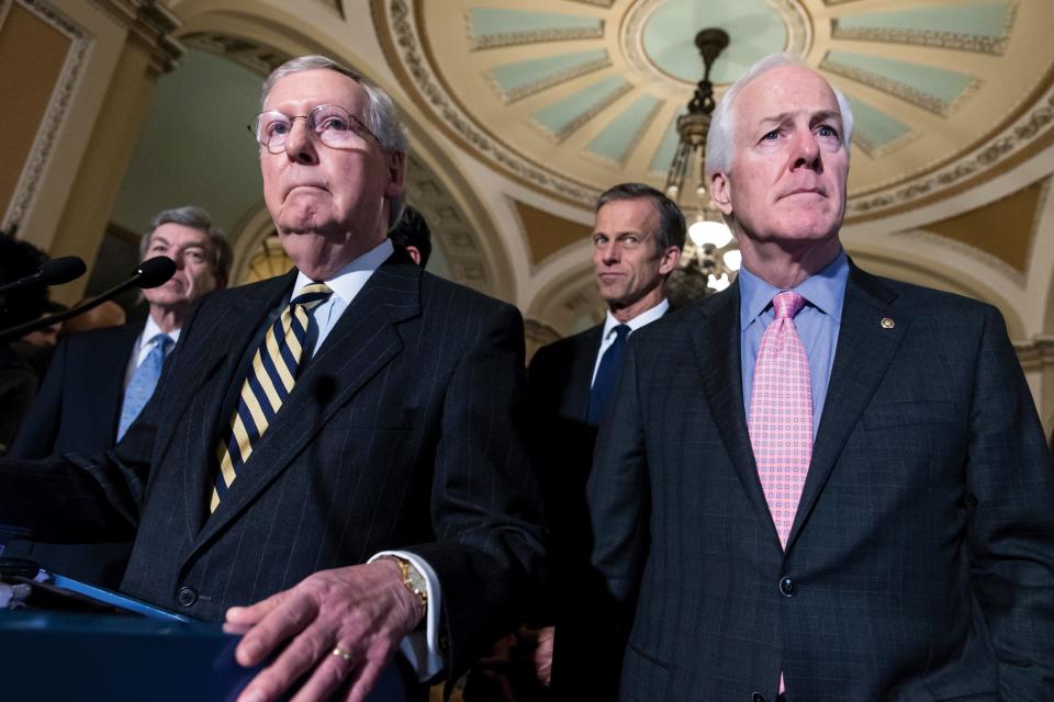 Sen. Mitch McConnell, R-Ky., left, and Sen. John Cornyn, R-Texas, right, talk to reporters following a closed-door policy meeting at the Capitol in Washington on March 8, 2016. In the aftermath of recent horrific mass shootings in Uvalde, Texas, and Buffalo, New York, a bipartisan group of senators, including Cornyn and Sen. Chris Murphy, D-Conn., are holding private virtual meetings during recess to try to strike a compromise over gun safety legislation.