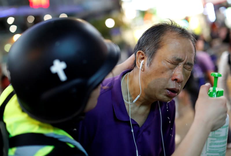 The Wider Image: Sermons with saline: Hong Kong pastor offers aid and prayers