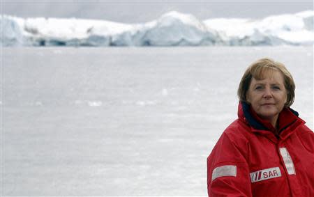 File photo of German Chancellor Angela Merkel standing aboard a ship during a visit to a fjord near Ilulissat in Greenland August 16, 2007. REUTERS/Michael Kappeler/Pool/Files