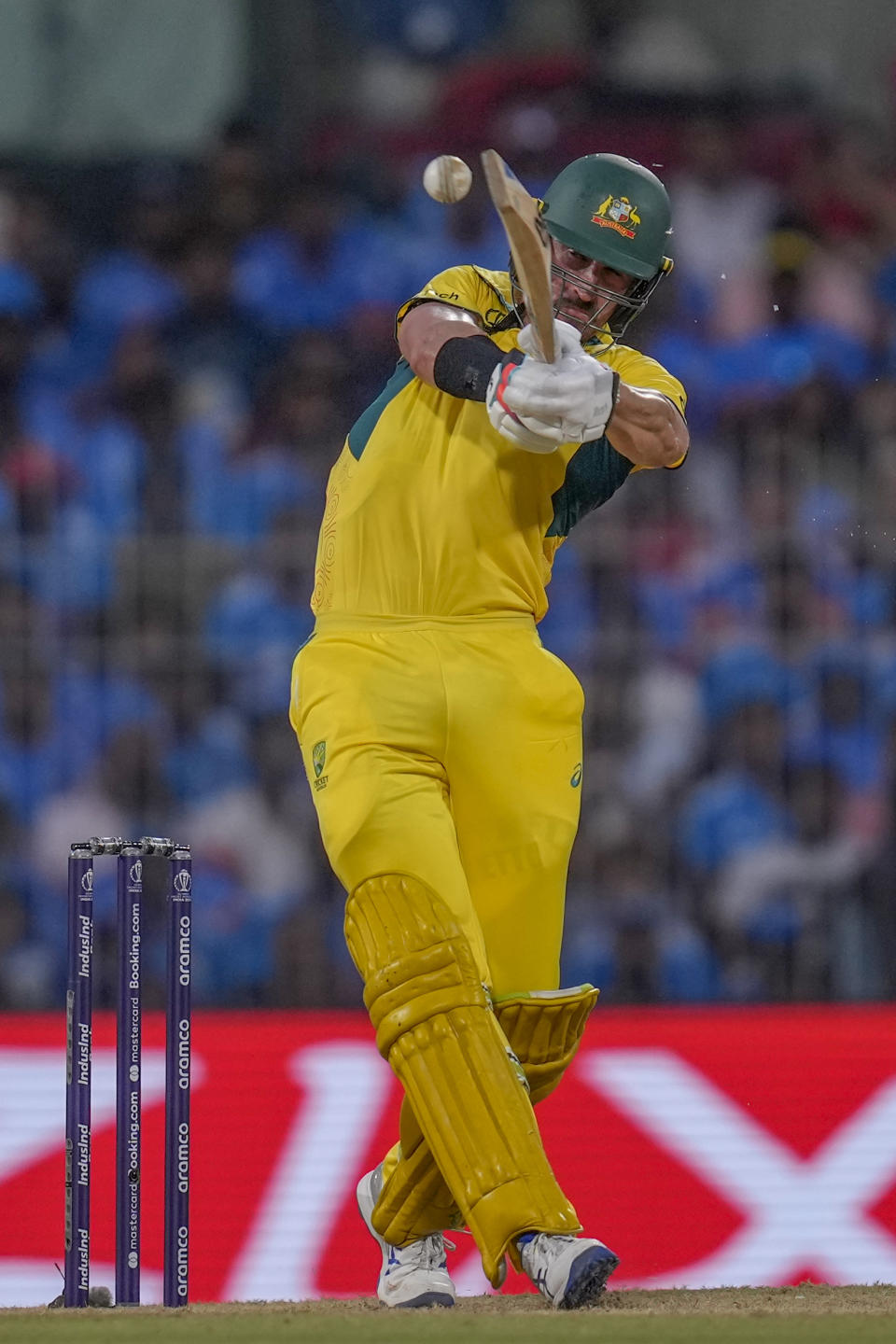 Australia's Mitchell Starc plays a shot during ICC Cricket World Cup match between India and Australia in Chennai, India, Sunday, Oct. 8, 2023. (AP Photo/Rafiq Maqbool)