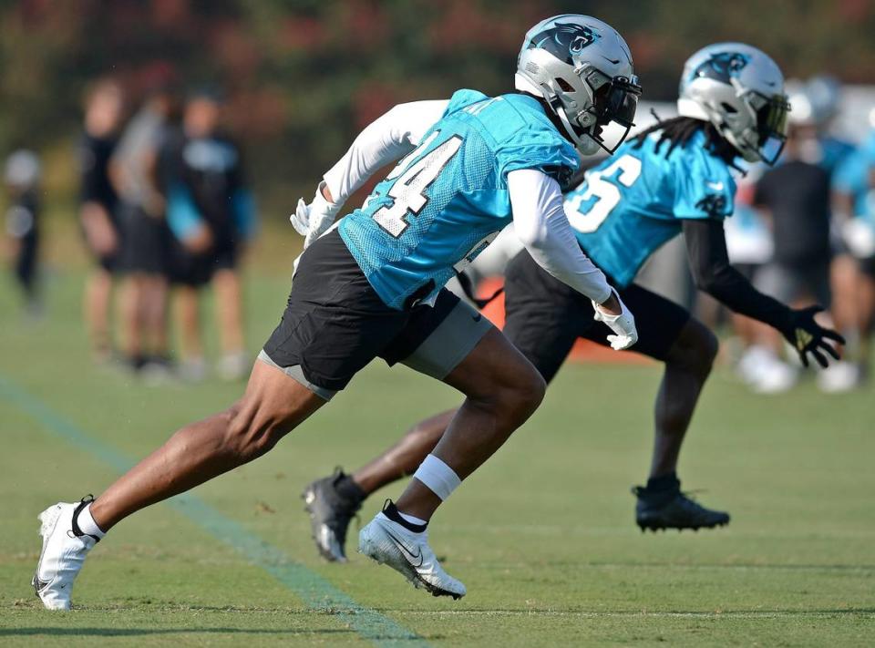 Carolina Panthers cornerbacks A.J. Bouve, left and Donte Jackson, right, rush across the field during a drill on Thursday, July 29, 2021 at Wofford College in Spartanburg, SC.