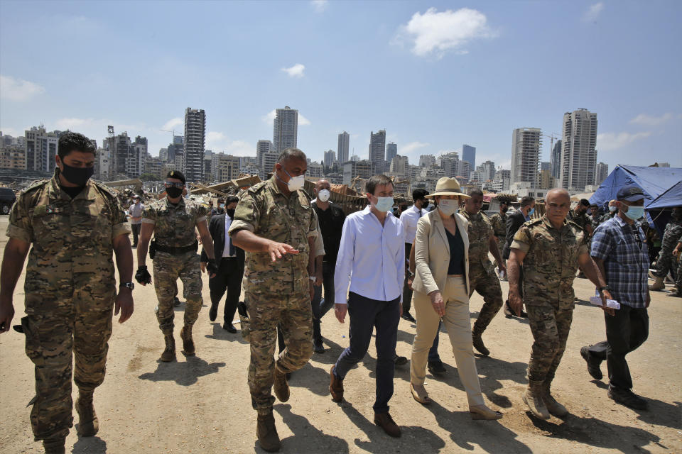 U.S. Undersecretary of State for Political Affairs David Hale, center left, and U.S. Ambassador to Lebanon Dorothy Shea, center right, visit the site of the Aug. 4 explosion in Beirut, Lebanon, Saturday, Aug. 15, 2020. (Nabil Monzer/Pool Photo via AP)