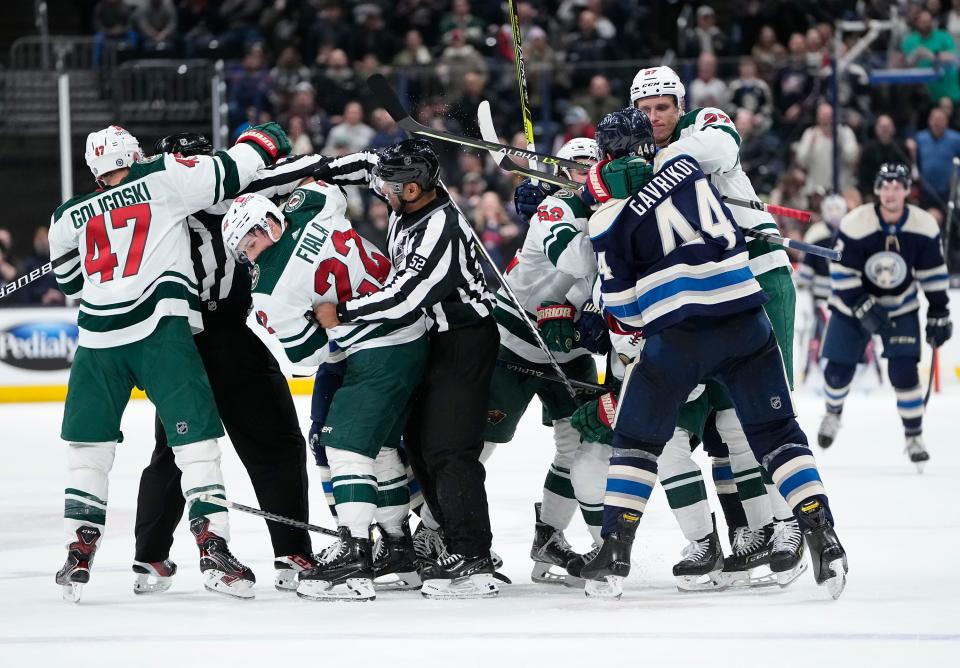 Columbus Blue Jackets and Minnesota Wild players get into a scrum during the third period of the NHL hockey game at Nationwide Arena in Columbus on March 11, 2022. The Blue Jackets won 3-2 in a shootout.