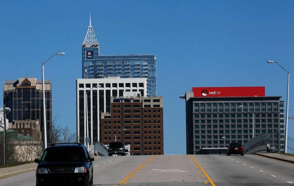 The Red Hat building sign looms large on the Raleigh skyline in 2014. Keeping Red Hat was a win for the city.