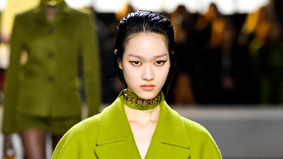 A model walks the runway during the Gucci Ready to Wear Fall/Winter 2024-2025 fashion show in a lime green coat