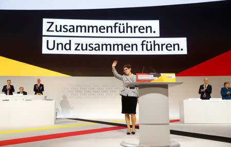 Annegret Kramp-Karrenbauer waves after being elected as the party leader during the Christian Democratic Union (CDU) party congress in Hamburg, Germany, December 7, 2018. REUTERS/Kai Pfaffenbach