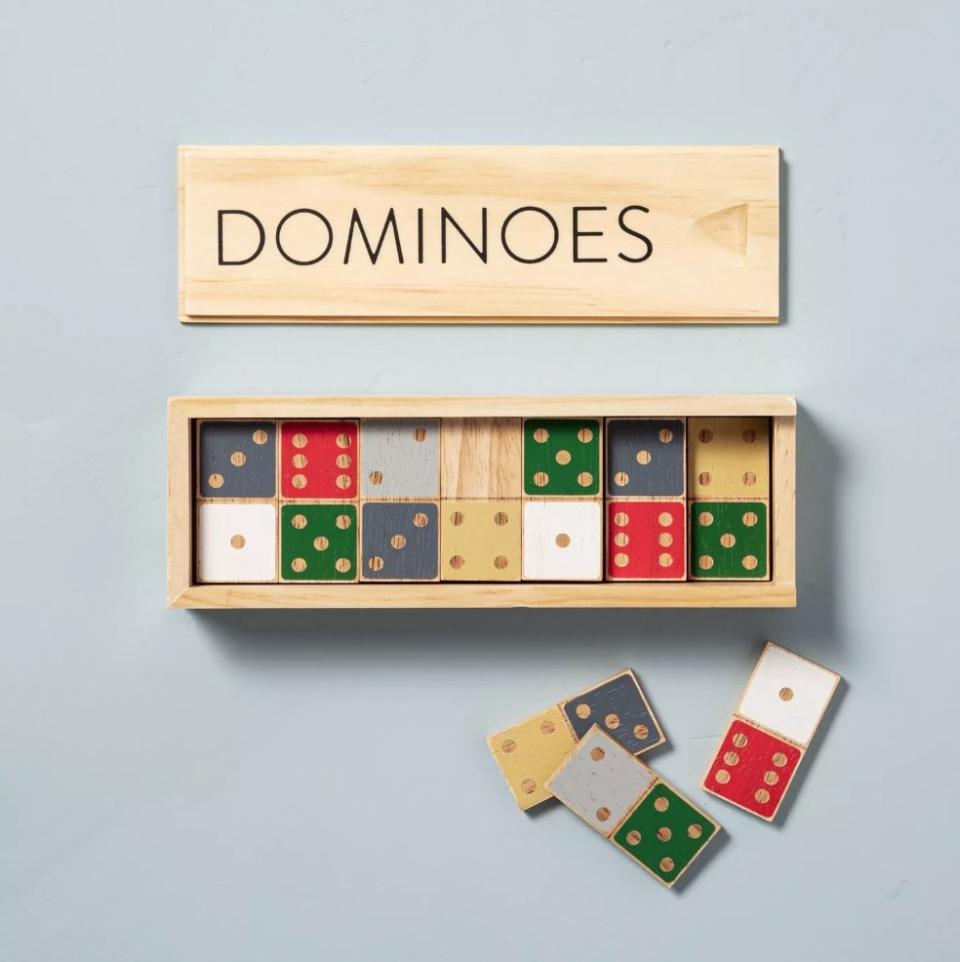 Wooden dominoes game set with blue/yellow, green/gray, and red/white domino pieces
