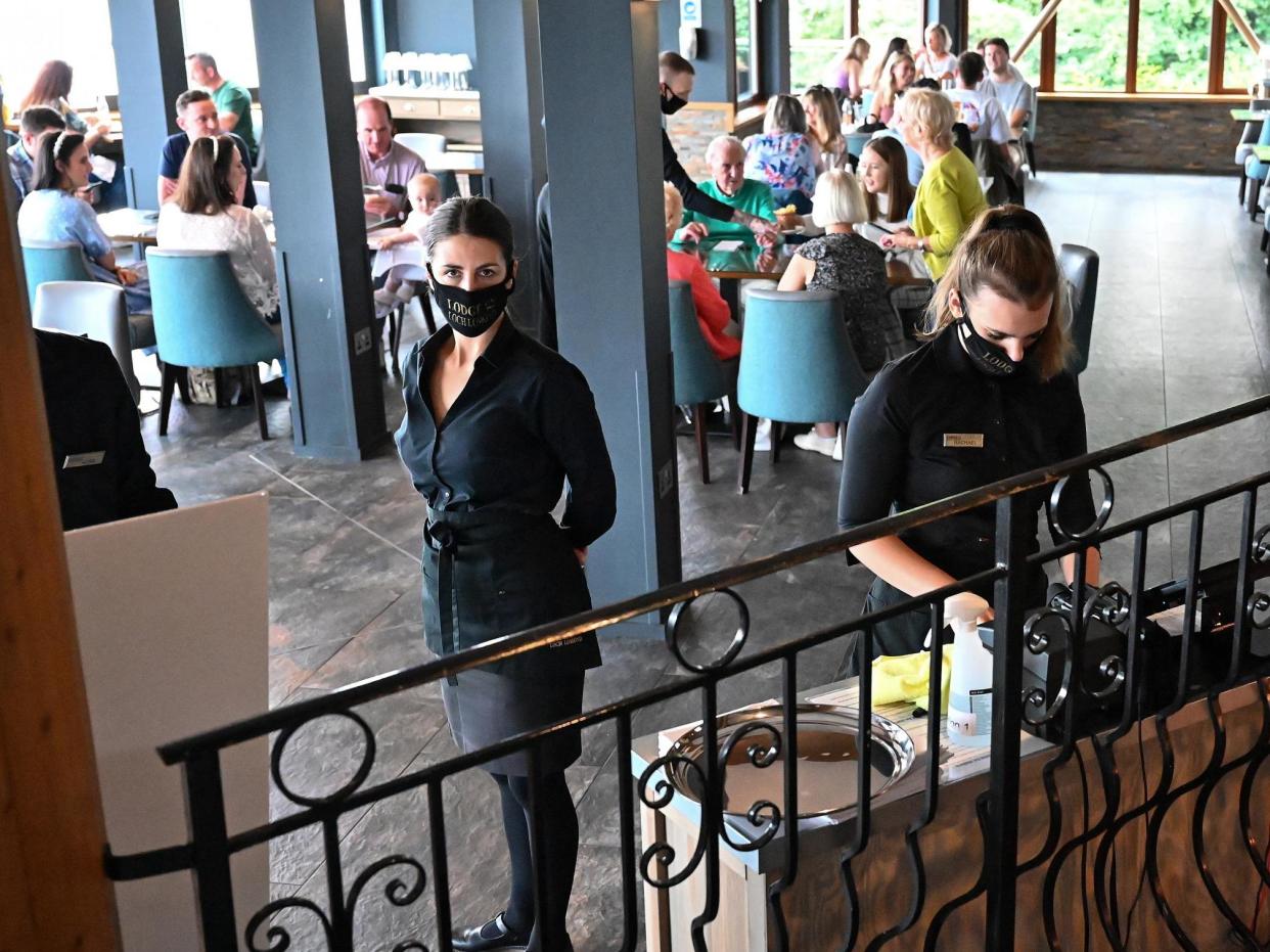 Staff wore masks but it didn't put people off going to restaurants for cheap meals: Getty