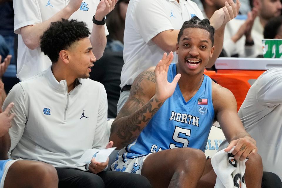 Nov 17, 2023; Chapel Hill, North Carolina, USA; North Carolina Tar Heels forward Armando Bacot (5) with Marcus Paige director of team and player development in the second half at Dean E. Smith Center. Mandatory Credit: Bob Donnan-USA TODAY Sports