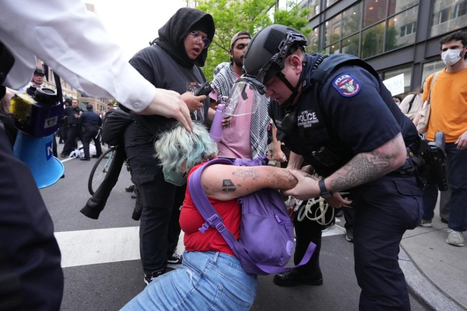 The arrested protesters were cuffed in the vicinity of Madison Ave and East 83rd Street after marching from CUNY’s Hunter College. James Keivom