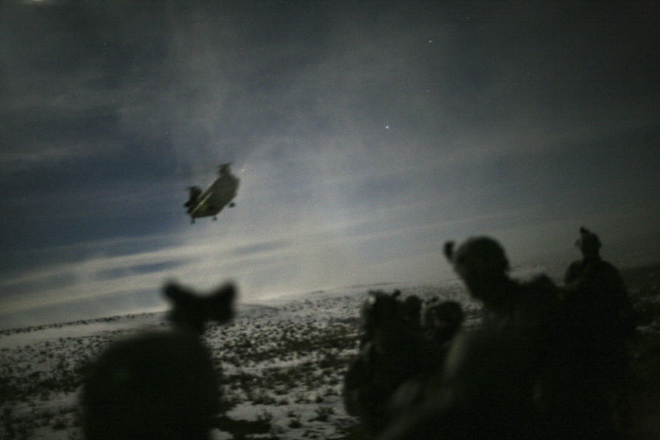 <p>A Chinook helicopter lands to pick up U.S. soldiers of the 101st Airborne Division following a night raid in Yahya Khel, Paktika province, Feb. 21, 2011. (Photo: Matt Robinson/Reuters) </p>