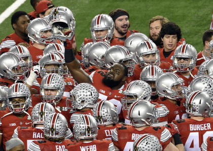 Ohio State Buckeyes defensive lineman Chris Carter (72) holds up his helmet prior to the game against the Oregon Ducks in the 2015 CFP National Championship at AT&T Stadium. (Jerome Miron-USA TODAY Sports)