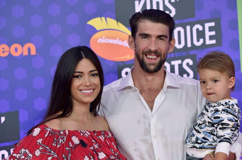 Michael and Nicole Phelps, with son Boomer, attend Nickelodeon's KIds' Choice Sports Awards in 2018. File Photo by Chris Chew/UPI