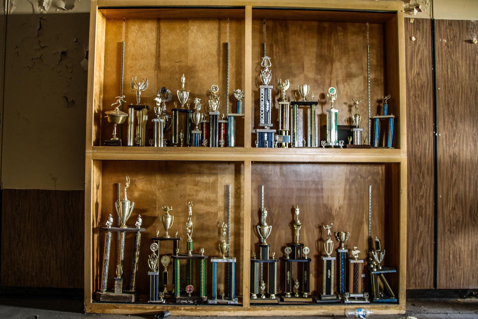 <p>The school trophy cabinet still holds sporting accolades from the school’s history. The school had been open for nearly 100 years before closing. (Photo: Leland Kent/Caters News) </p>