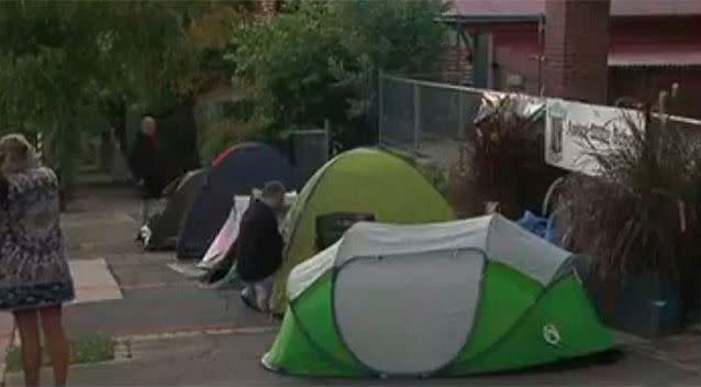 Family members set up camp along Pringle Street outside Ascot State School. Source: 7News