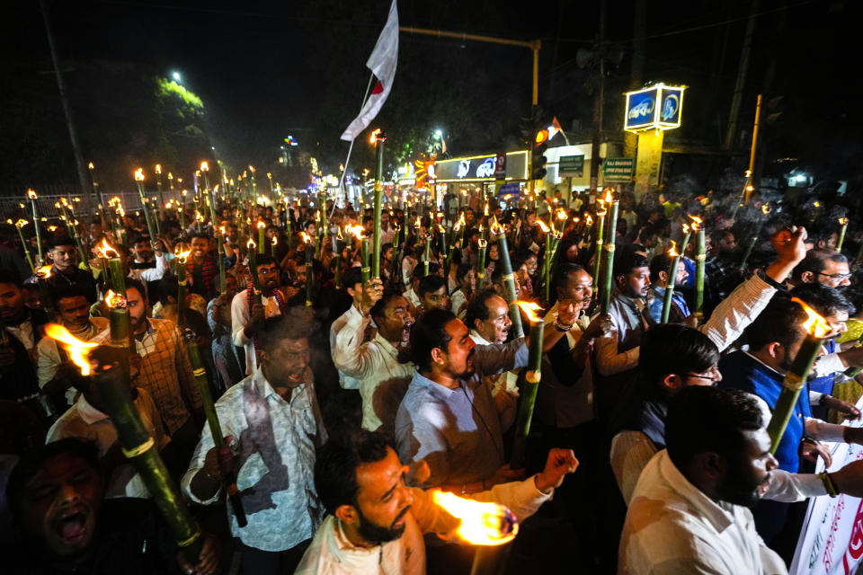 All Assam Students Union (AASU) members take out a torch procession to protest against the Citizenship Amendment Act (CAA) in Guwahati, India, Tuesday, March 12, 2024. India has implemented a controversial citizenship law that has been widely criticized for excluding Muslims, a minority community whose concerns have heightened under Prime Minister Narendra Modi's Hindu nationalist government. The act provides a fast track to naturalization for Hindus, Parsis, Sikhs, Buddhists, Jains and Christians who fled to Hindu-majority India from Afghanistan, Bangladesh and Pakistan before Dec. 31, 2014. (AP Photo/Anupam Nath)